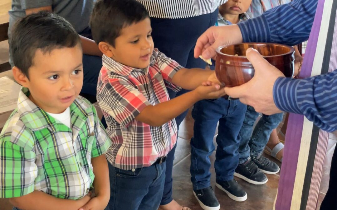 kids taking communion in Honduras