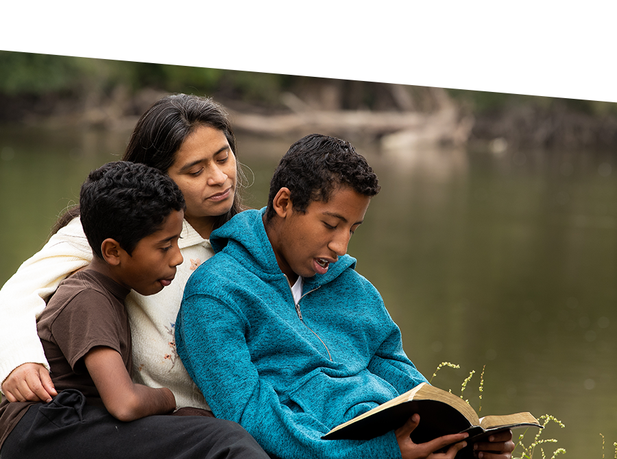 mother and sons reading the Bible